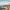 Panoramablick auf Zürich mit der Limmat, historischen Gebäuden und markanten Kirchtürmen bei Tageslicht.